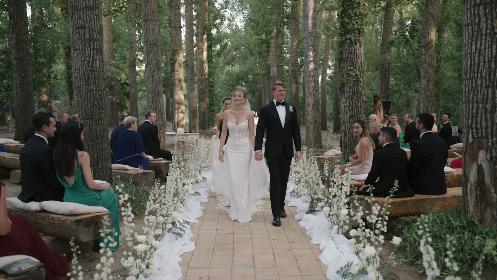 Isabella and Christian walking back down the aisle of their destination wedding at Tenuta Savoca, Piazza Armerina, Sicily